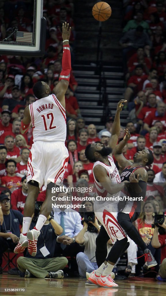 Houston Rockets center Dwight Howard left, jumps for a loose ball ...
