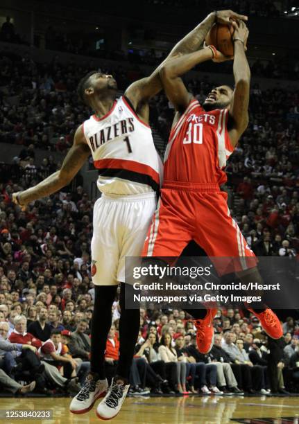 Portland Trail Blazers forward Dorell Wright defends a shot by Houston Rockets guard Troy Daniels during the second quarter of Game 4 of the Western...