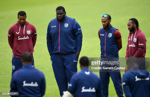 Shannon Garbiel, Rahkeem Cornwall, Kraigg Braithwaite and Jomel Warrican of the West Indies observe a minutes silence with their team mates in memory...