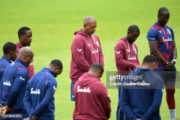 Phil Simmons, Head Coach of the West Indies observes a minutes silence alongside his team in memory of former West Indies batsman Sir Everton Weekes...