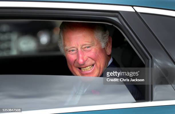 Prince Charles, Prince of Wales departs in a Audi etron electric car after meeting key workers from Transport for London, who have worked throughout...