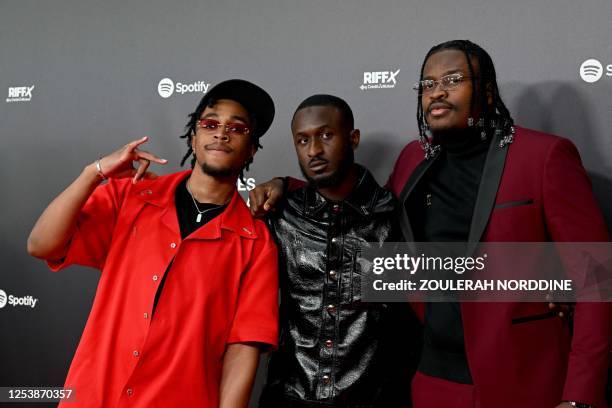 Members of 4Keus Gang rap music band, Bne, Djeffi and HK pose during a photo call prior to the first edition of "Les Flammes" music award ceremony at...