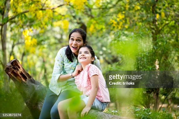 mother and daughter spending leisure time at park - family india stock pictures, royalty-free photos & images