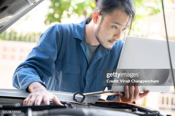 Mechanic Using A Computer 58 Types Of Grease Stock Photos, High-Res Pictures, and Images - Getty ...