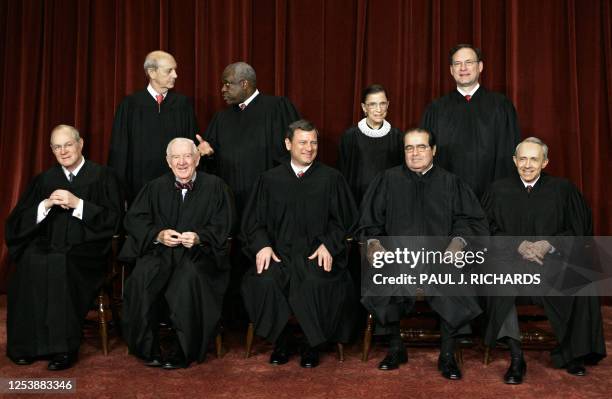 Justices of the US Supreme Court pose for their class photo 03 March 2006 inside the Supreme Court in Washington, DC. Front from left are Anthony...