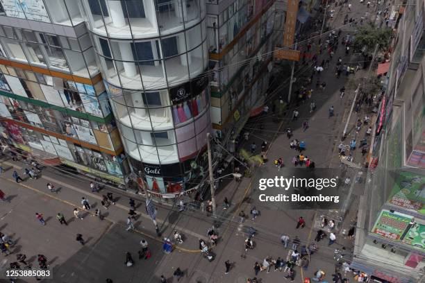 Pedestrians walk through the Gamarra textile center in Lima, Peru, on Thursday, May 11, 2023. According to economists, Peru's central bank is likely...