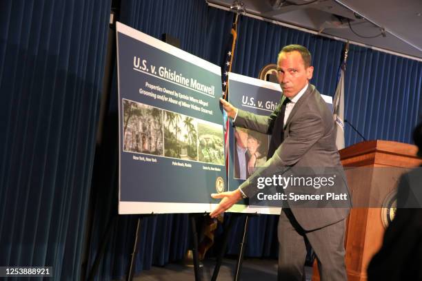 Picture boards are placed on a stand at a press conference to announce the arrest of Ghislaine Maxwell, the longtime girlfriend and accused...