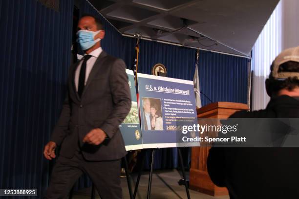 Picture boards are placed on a stand at a press conference to announce the arrest of Ghislaine Maxwell, the longtime girlfriend and accused...