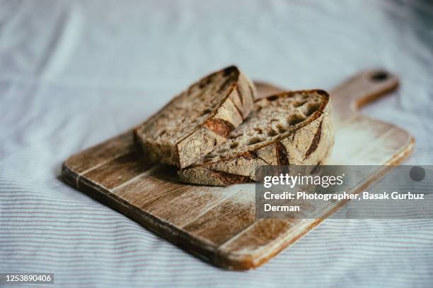 slices of crusty sourdough bread - sliced bread bildbanksfoton och bilder