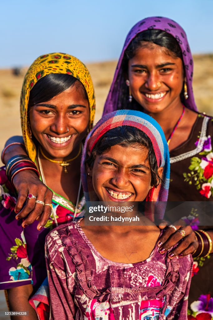 Group of happy Gypsy Indian girls, desert village, India