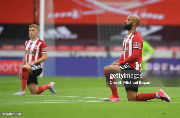 David McGoldrick of Sheffield United takes a knee in support of the Black Lives Matter movement prior to the Premier League match between Sheffield...
