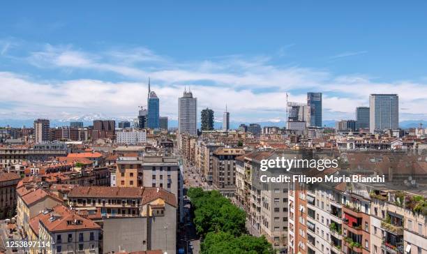 milan and the mountains - milan skyline stock pictures, royalty-free photos & images