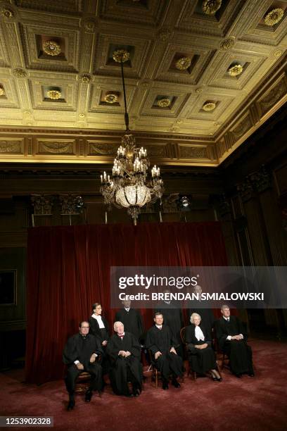 Justices of the US Supreme Court justices posing for their class photo 31 October 2005 at the Supreme Court in Washington, DC. Seen in this image...