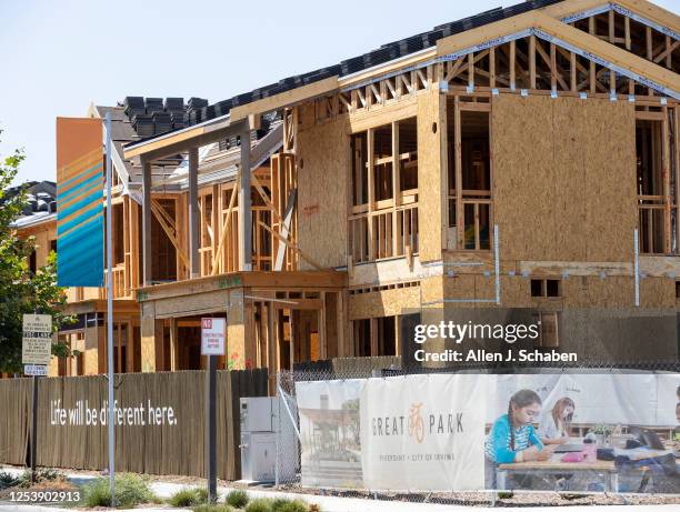 Irvine, CA Workers construct a new home in The Great Park Neighborhoods in Irvine on Monday, Aug. 9, 2021.
