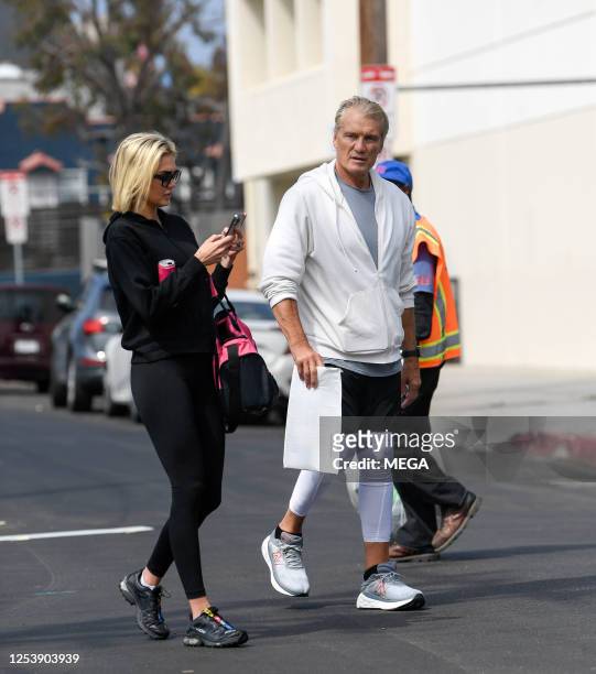 Dolph Lundgren and fiancee Emma Krokdal are seen arriving at the gym on May 11, 2023 in Los Angeles, California.