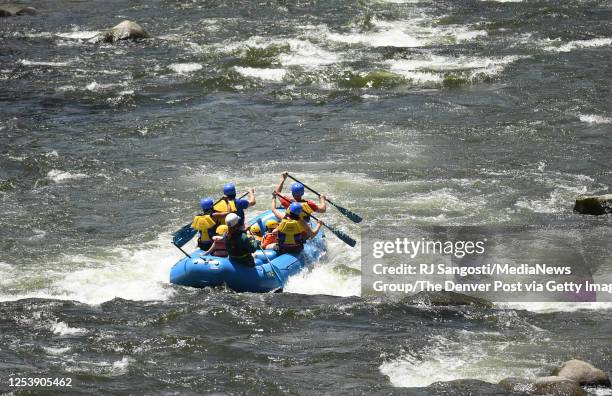 Rafters on a commercial raft trip make their way down the Arkansas River on June 27, 2020 outside of Buena Vista, Colorado.