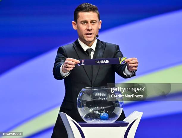 Former Uzbekistan footballer Server Djeparov draws the name of Bahrain during the Asian Football Confederation Asian Cup Qatar 2023 drawing ceremony...