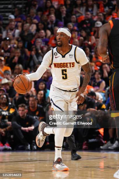 Kentavious Caldwell-Pope of the Denver Nuggets dribbles the ball during Game Six of the Western Conference Semi-Finals of the 2023 NBA Playoffs...