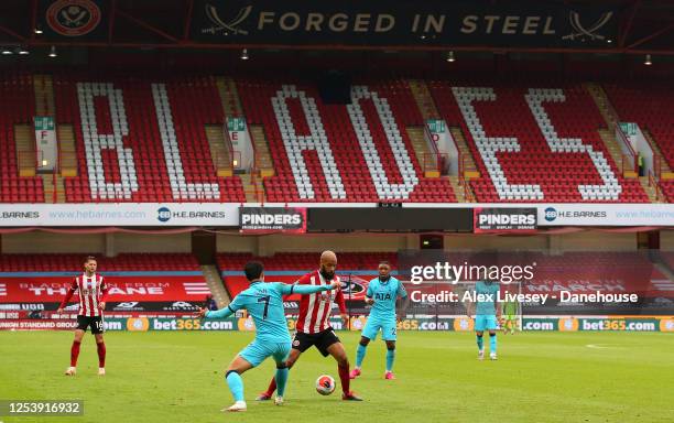 David McGoldrick of Sheffield United controls the ball ahead of Son Heung-Min of Tottenham Hotspur during the Premier League match between Sheffield...