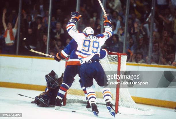 Wayne Gretzky of the Edmonton Oilers scores a goal against the New York Islanders in the 1984 NHL Stanley Cup Finals on May 19, 1984 at the...