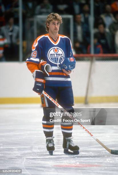 Wayne Gretzky of the Edmonton Oilers stands for the National Anthem prior to the start of an NHL Hockey game against the New York Rangers circa 1979...