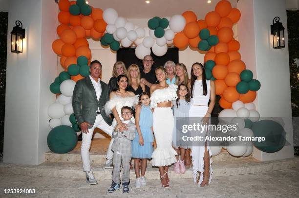 Thomas "TJ" Earle , Alix Earle and Ashley Alexandra Dupre pose with guests during Alix Earle's University of Miami graduation celebration on May 11,...