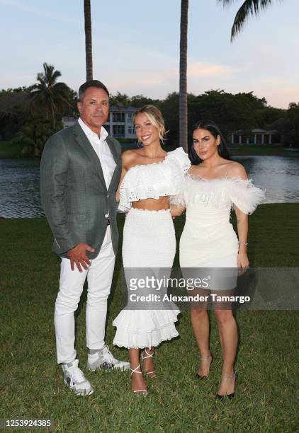 Thomas "TJ" Earle, Alix Earle and Ashley Alexandra Dupre are seen during Alix Earle's University of Miami graduation celebration on May 11, 2023 in...