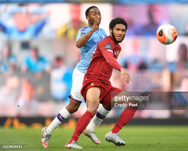 Joe Gomez of Liverpool is challenged by Raheem Sterling of Manchester City during the Premier League match between Manchester City and Liverpool FC...