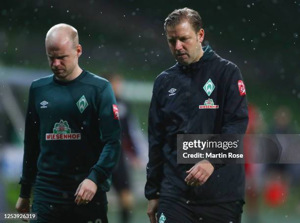 Davy Klaassen and Florian Kohfeldt, head coach of Bremen walk off dejected after the final whistle the Bundesliga playoff first leg match between...