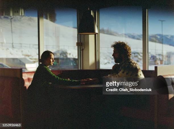 man and woman resting on gas station - film darchive photos stock pictures, royalty-free photos & images