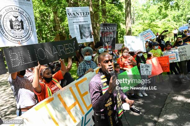 Jamell Henderson, a protest organizer, speaks outside of Michael Bloomberg's Southampton home demanding higher taxation of billionaires on July 1,...