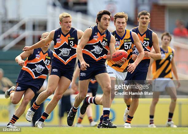 Ozgur Uysal of the Cannons runs out of the pack during the TAC Cup preliminary Final match between the Sandringham Dragons v Calder Cannons at Visy...