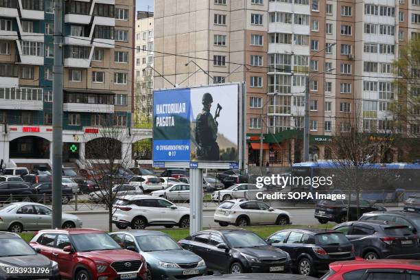 View of an advertising billboard in Saint Petersburg calling on citizens to enlist with the armed forces of Russia.