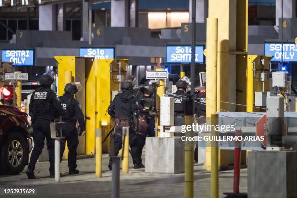 Customs and Border Protection officers leave after guarding the port of entry seen from the Mexican side of San Ysidro port of entry on the...