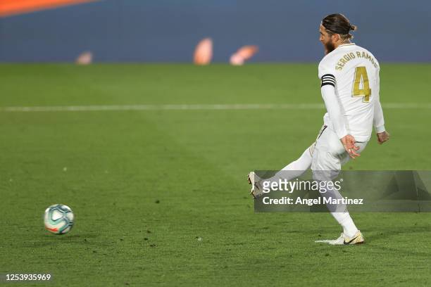 Sergio Ramos of Real Madrid scores his team's first goal with a penalty during the Liga match between Real Madrid CF and Getafe CF at Estadio Alfredo...