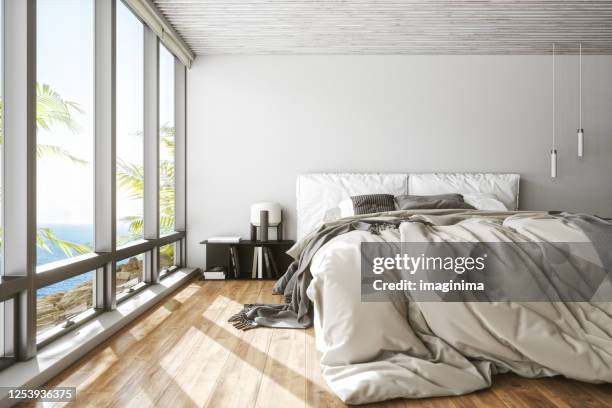 modern bedroom with sea view - luxury hotel room stock pictures, royalty-free photos & images