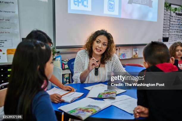 Tenn. Lina Horton works in small groups on english with her second grade students at Burns Darden Elementary School.