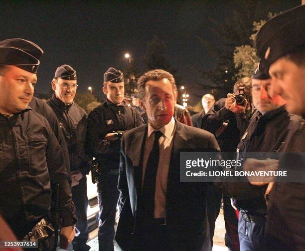 French Interior minister Nicolas Sarkozy speaks with police forces during his visit in "Le Mirail", a tough neighbourhood of Toulouse, west southern...