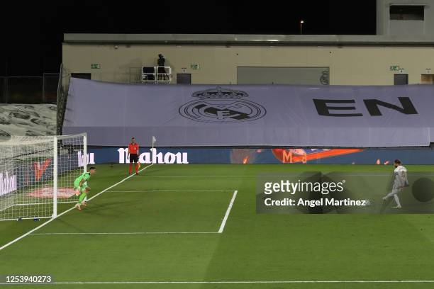 Sergio Ramos of Real Madrid scores his team's first goal with a penalty during the Liga match between Real Madrid CF and Getafe CF at Estadio Alfredo...