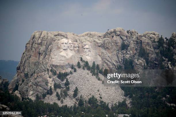 The busts of U.S. Presidents George Washington, Thomas Jefferson, Theodore Roosevelt and Abraham Lincoln tower over the Black Hills at Mount Rushmore...