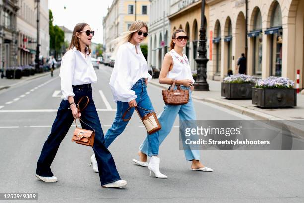Influencer Annette Weber wearing a white blouse by Seidensticker, a denim jeans by Levis and a light brown bag by Jimmy Choo, influencer Alex...