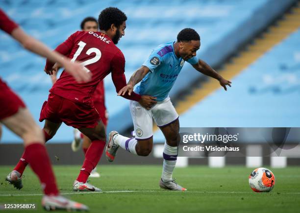 Raheem Sterling of Manchester City is fouled by Joe Gomez of Liverpool and a penalty is awarded during the Premier League match between Manchester...