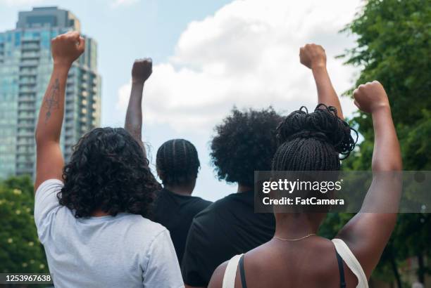 group of african american people protest - anti racism stock pictures, royalty-free photos & images