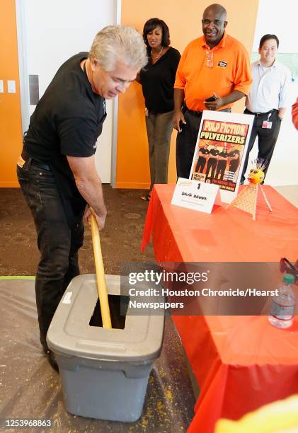 Dave Brown with the Pulp Fiction Pulverizers team made up of Minute Maid employees beat the Guinness World Record of squeezing OJ from fresh oranges...