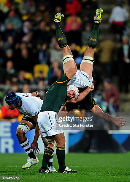 Flanker Schalk Burger of the Springboks is upended at a restart despite the supoport from teammate Heinrich Brussow during the IRB 2011 Rugby World...