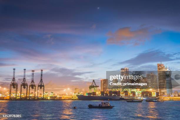 central business district singapore there are many financial building ,hotel  near marina bay district a popular tourist attraction of singapore with ship and logistic background - singapore port stock pictures, royalty-free photos & images