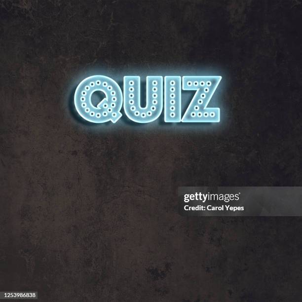 quiz word in blue neon lights.black background - examinations imagens e fotografias de stock