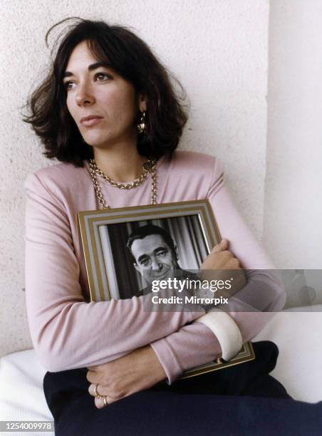 Ghislaine Maxwell, youngest child of media proprietor and fraudster, Robert Maxwell , holding a framed photograph of her late father, Jerusalem,...