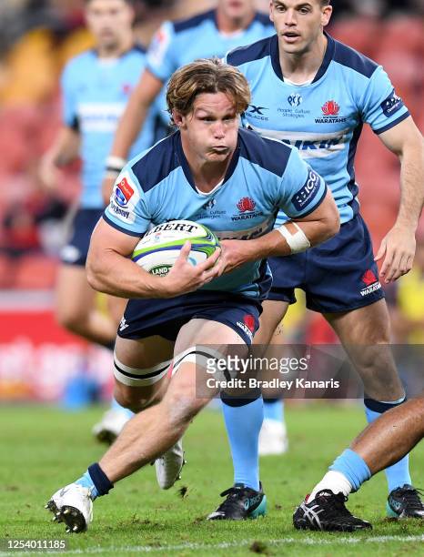 Michael Hooper of the Waratahs runs with the ball during the round 1 Super Rugby AU match between the Queensland Reds and the New South Wales...