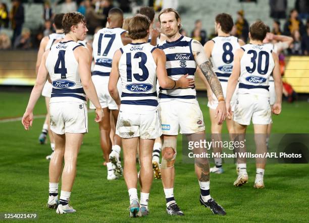 Jhye Clark and Tom Stewart of the Cats look dejected after a loss during the 2023 AFL Round 09 match between the Richmond Tigers and the Geelong Cats...